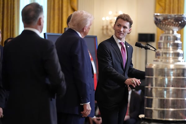 President Donald Trump, center, listens as Matthew Tkachuk, of the 2024 NHL Stanley Cup champion Florida Panthers hockey team, speaks during a ceremony to honor the team in the East Room of the White House, Monday, Feb. 3, 2025, in Washington. (AP Photo/Evan Vucci)