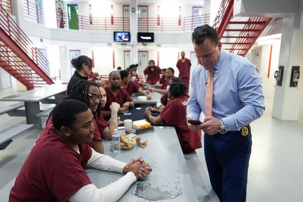 Genesee County Sheriff Chris Swanson talks with inmates in the I.G.N.I.T.E. program at the county jail, Jan. 28, 2025 in Flint, Mich. (AP Photo/Paul Sancya)