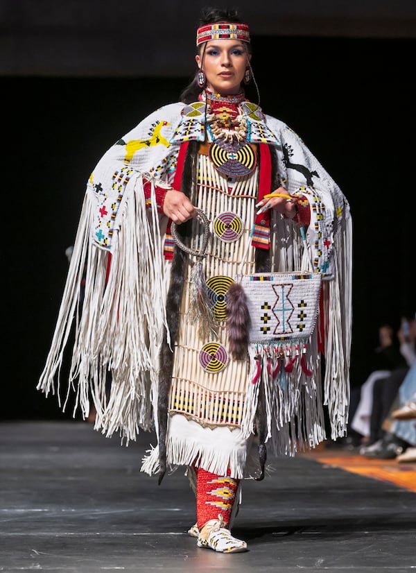 A model wears a design by Livia Manywounds on the runway at the 2025 Native Fashion Show, Friday, May 9, 2025, in Santa Fe, N.M. (AP Photo/Roberto E. Rosales)