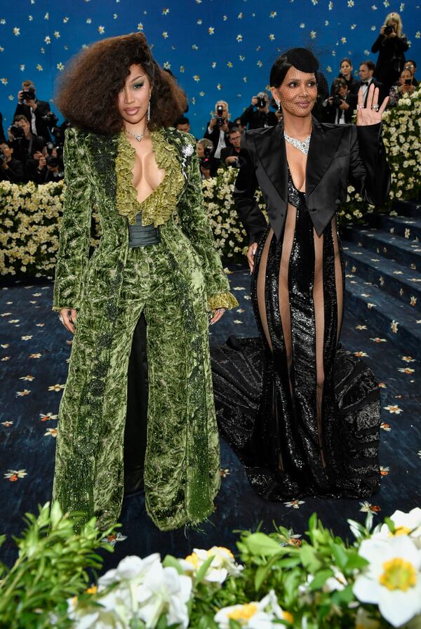 Cardi B, left and Halle Berry attend The Metropolitan Museum of Art's Costume Institute benefit gala celebrating the opening of the "Superfine: Tailoring Black Style" exhibition on Monday, May 5, 2025, in New York. (Photo by Evan Agostini/Invision/AP)