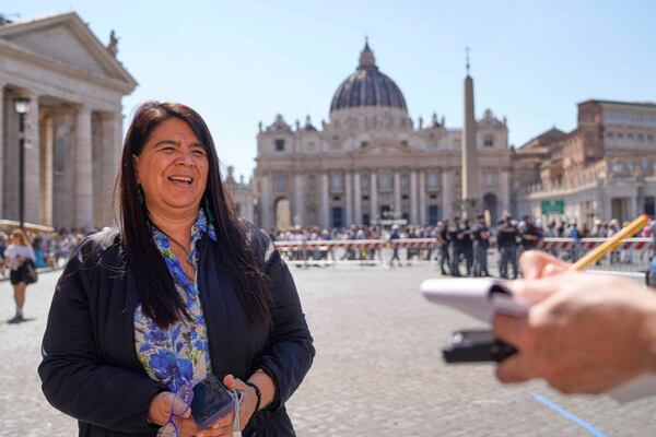 Peruvian investigative journalist Paola Margot Ugaz Cruz talks with the Associated Press near St. Peter's Square at the Vatican, Monday, May 19, 2025. (AP Photo/Gregorio Borgia)