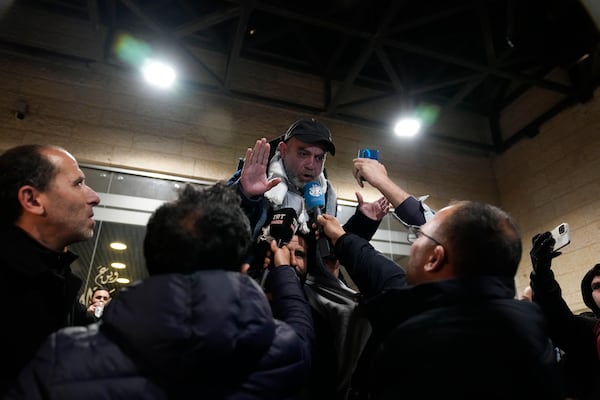 A Palestinian prisoner speaks to the media after being released from Israeli prison following a ceasefire agreement between Israel and Hamas, in the West Bank city of Ramallah, Thursday, Feb. 27, 2025. (AP Photo/Nasser Nasser)