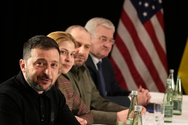 Ukraine's President Volodymyr Zelenskyy, left, attends a meeting with United States Vice-President JD Vance on the sidelines of the Munich Security Conference in Munich, Germany, Friday, Feb. 14, 2025. (AP Photo/Matthias Schrader)