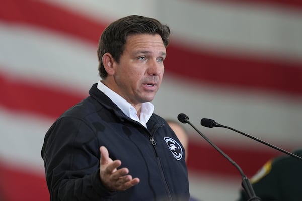 Florida Gov. Ron De Santis speaks during a press conference on immigration enforcement, at Homestead Air Force Base, Wednesday, Feb. 26, 2025, in Homestead, Fla. (AP Photo/Rebecca Blackwell)