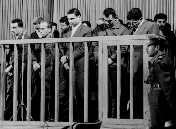 FILE - Elie Cohen, far left, head of an Israeli spy ring, listens as he is sentenced to death by a special military court in Damascus, Syria, May 8, 1965. (AP Photo/LEB)