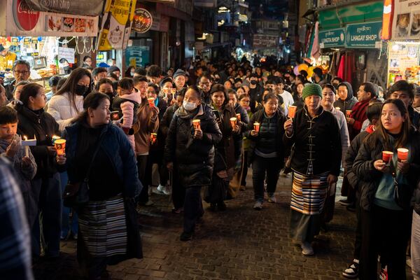 Exiled Tibetans participate in a candlelit vigil in Dharamshala, India, Wednesday, Jan. 8, 2025, in solidarity with the victims of an earthquake that hit a high-altitude Tibet region in western China on Tuesday. (AP Photo/Ashwini Bhatia)