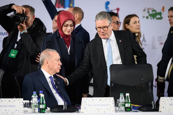 Britain's Prime Minister Keir Starmer, right, and Turkey's President Recep Erdogan attend a plenary meeting at the beginning of a summit where the leaders of 47 European countries and organizations will discuss security, defense and democratic standards, in Tirana, Albania, Friday, May 16, 2025. (Leon Neal/Pool via AP)