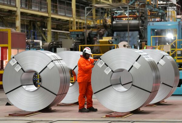 A steel worker works at the ArcelorMittal Dofasco steel plant in Hamilton, Ont., on Wednesday, March 12, 2025. (Nathan Denette /The Canadian Press via AP)