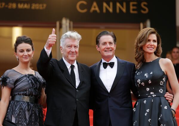 FILE - Emily Stofle, from left, director David Lynch actor Kyle MacLachlan, and Desiree Gruber appear at the screening of the TV series "Twin Peaks" at the 70th international film festival, Cannes, southern France, on May 25, 2017(AP Photo/Alastair Grant, File)