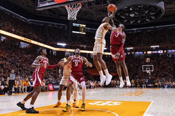 Tennessee guard Chaz Lanier (2) has his shot blocked by Arkansas forward Adou Thiero (3) during the first half of an NCAA college basketball game Saturday, Jan. 4, 2025, in Knoxville, Tenn. (AP Photo/Wade Payne)