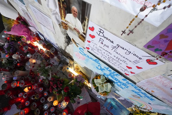 Candles for Pope Francis are seen in front of the Agostino Gemelli Polyclinic, in Rome, Friday, March 7, 2025, where the Pontiff is hospitalized since Friday, Feb. 14. (AP Photo/Andrew Medichini)