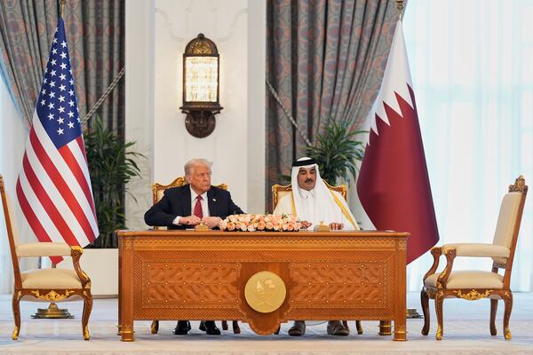 President Donald Trump and Qatar's Emir Sheikh Tamim bin Hamad Al Thani attend a signing ceremony at the Amiri Diwan in Doha, Qatar, Wednesday, May 14, 2025. (AP Photo/Alex Brandon)