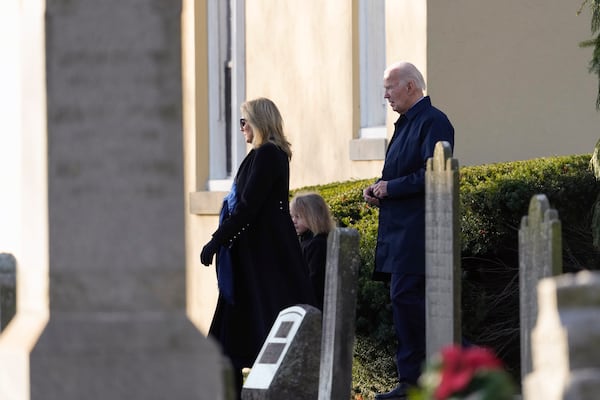 President Joe Biden, first lady Jill Biden and grandson Beau Biden walk from Brandywine Catholic Church in Wilmington, Del., on Wednesday, Dec. 18, 2024. Wednesday marks the 52nd anniversary of the car crash that killed Joe Biden's first wife Neilia Hunter Biden and 13-month-old daughter Naomi. (AP Photo/Ben Curtis)