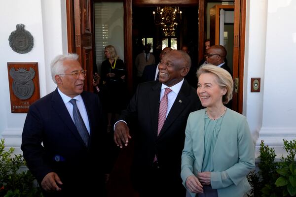 South Africa's President Cyril Ramaphosa, center, shares a light moment with European Union Council President Antonio Costa, left, and Ursula von der Leyen, the European Commission President ahead of the eighth EU-South Africa summit in Cape Town, South Africa, Thursday, March 13, 2025. (AP Photo/Nardus Engelbrecht)