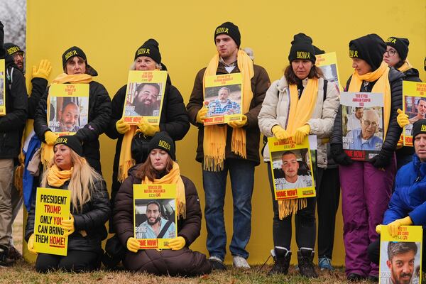 Israeli hostage families and others rally on the National Mall near the Washington Monument, to encourage President-elect Donald Trump to bring home remaining hostages held in Gaza, Sunday, Jan. 19, 2025, in Washington. (AP Photo/Julio Cortez)