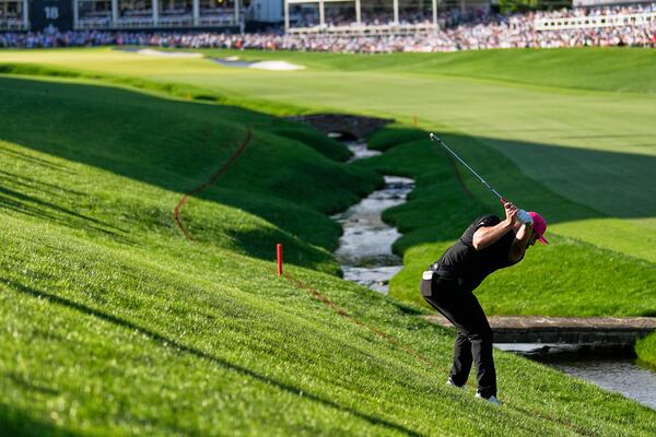 Jon Rahm, of Spain, hits from the rough on the 18th hole during the final round of the PGA Championship golf tournament at the Quail Hollow Club, Sunday, May 18, 2025, in Charlotte, N.C. (AP Photo/George Walker IV)