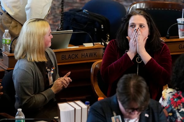 Rep. Aime Wichtendahl, D-Hiawatha, reacts after speaking during debate on the gender identity bill, Thursday, Feb. 27, 2025, at the Statehouse in Des Moines, Iowa. (AP Photo/Charlie Neibergall)