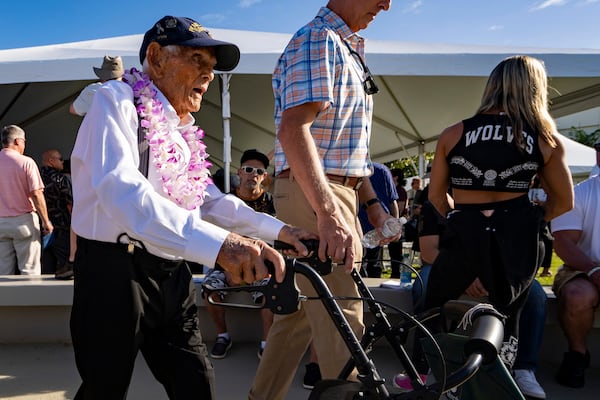 FILE - Pearl Harbor survivor Harry Chandler, 102, of Tequesta, Fla., leaves the 82nd Pearl Harbor Remembrance Day ceremony on Dec. 7, 2023, at Pearl Harbor in Honolulu. (AP Photo/Mengshin Lin, File)