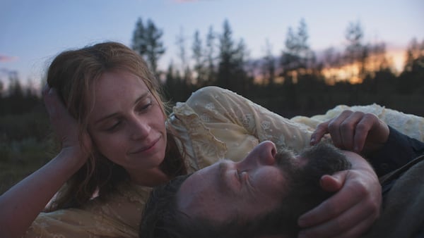 This image released by the Sundance Institute shows Joel Edgerton, foreground, and Felicity Jones in a scene from "Train Dreams" by Clint Bentley, an official selection of the 2025 Sundance Film Festival. (Adolpho Veloso/Sundance Institute via AP)