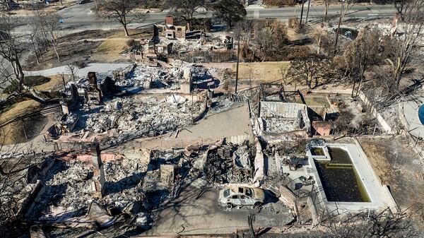 Residences destroyed by the Eaton Fire line a neighborhood in Altadena, Calif., on Tuesday, Jan. 21, 2025. (AP Photo/Noah Berger)