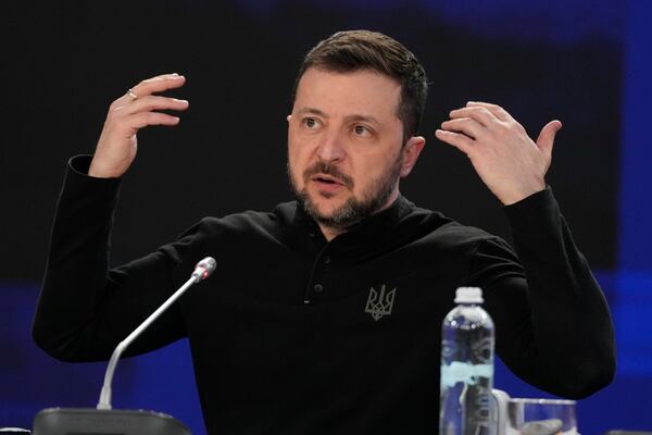 Ukrainian President Volodymyr Zelenskyy gestures during a news conference at a security summit in Kyiv, Ukraine, Monday, Feb. 24, 2025. (Frank Gunn/The Canadian Press via AP)