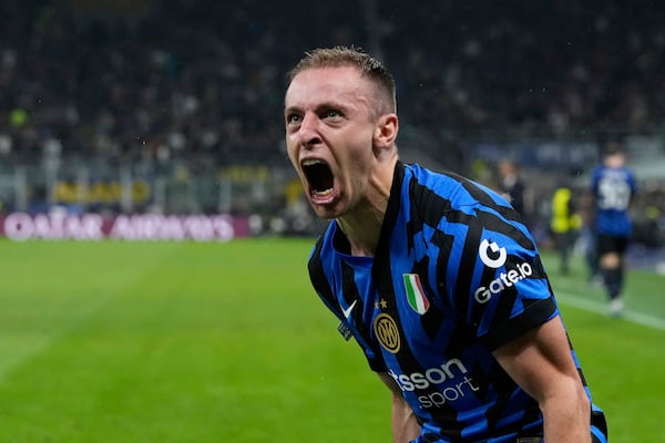 Inter Milan's Davide Frattesi celebrates after scoring his side's fourth goal during the Champions League semifinal second leg soccer match between Inter Milan and Barcelona at San Siro stadium in Milan , Italy, Tuesday, May 6, 2025. (AP Photo/Luca Bruno)