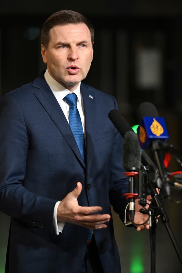 Estonia's Defense Minister Hanno Pevkur speaks with the media as he arrives for a meeting of NATO defense ministers at NATO headquarters in Brussels, Thursday, Feb. 13, 2025. (AP Photo/Harry Nakos)