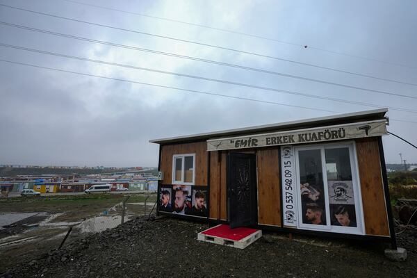 FILE - A container that was turned into a barber shop by its owner whose business was destroyed in the powerful earthquake in 2023, in Antakya, southern Turkey, Friday, Jan. 12, 2024. (AP Photo/Khalil Hamra, File)