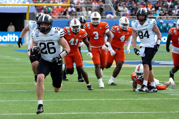 Iowa State running back Carson Hansen (26) runs past the Miami defense for 30-yard touchdown during the first half of the Pop Tarts Bowl NCAA college football game, Saturday, Dec. 28, 2024, in Orlando, Fla. (AP Photo/John Raoux)