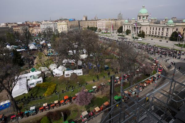 A view of students and former paramilitary fighters loyal to President Aleksandar Vucic camp outside the presidency building prior to a major anti-corruption rally in downtown Belgrade, Serbia, Saturday, March 15, 2025. (AP Photo/Darko Vojinovic)