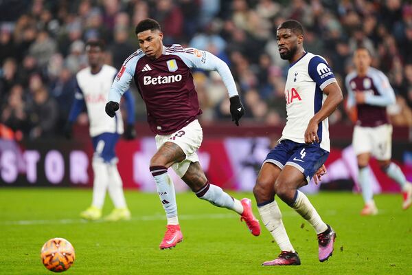 Aston Villa's Marcus Rashford (left) and Tottenham Hotspur's Kevin Danso battle for the ball during the English FA Cup fourth round soccer match between Aston Villa and Tottenham Hotspur at Villa Park, Birmingham, England, Sunday Feb. 9, 2025. (Mike Egerton/PA via AP)