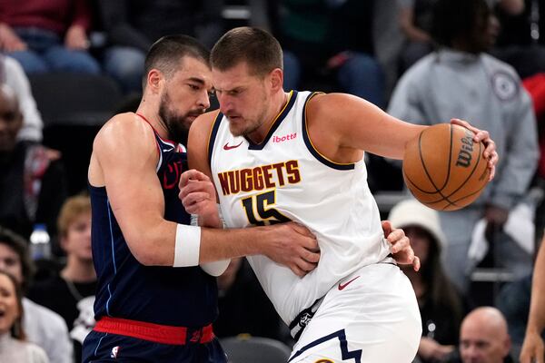 Denver Nuggets center Nikola Jokic, right, drives against Los Angeles Clippers center Ivica Zubac during the first half in Game 6 of an NBA basketball first-round playoff series Thursday, May 1, 2025, in Inglewood, Calif. (AP Photo/Mark J. Terrill)