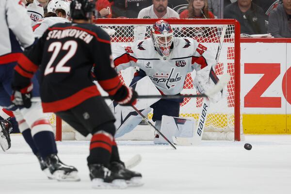 Carolina Hurricanes' Logan Stankoven (22) has his shot blocked by Washington Capitals goaltender Logan Thompson (48) during the first period of Game 4 of a second-round NHL hockey playoff series in Raleigh, N.C., Monday, May 12, 2025. (AP Photo/Karl DeBlaker)
