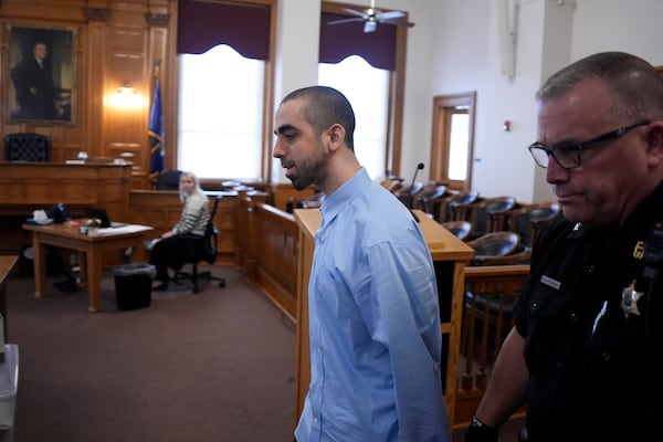 Hadi Matar is escorted into the courtroom at the Chautauqua County Courthouse ahead of the second day in his trial, Tuesday, Feb. 11, 2025, in Mayville, N.Y. Matar is charged with stabbing famed author Salman Rushdie. (AP Photo/Gene J. Puskar)