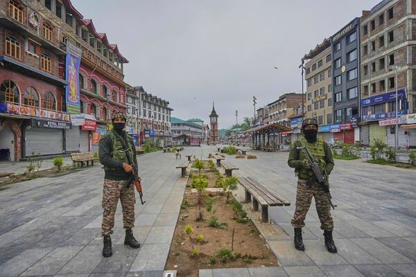 Indian paramilitary soldiers stand guard after loud explosions were heard in Srinagar, in Indian controlled Kashmir, Saturday, May 10, 2025.(AP Photo/Mukhtar Khan)