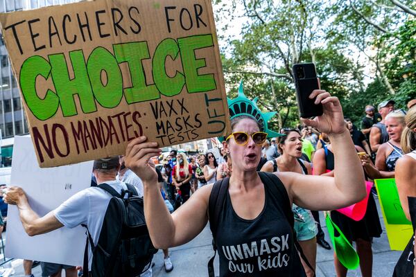 FILE - This photo from Wednesday Aug. 25, 2021, shows teachers protesting against COVID-19 vaccination mandates in New York. (AP Photo/Mary Altaffer, file)