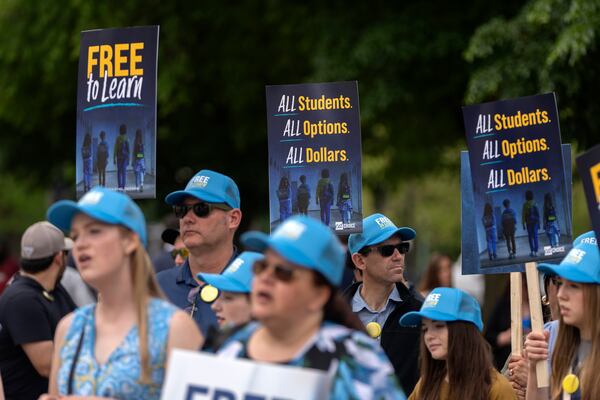 Supporters of charter schools rally outside of the Supreme Court on Wednesday, April 30, 2025, in Washington. (AP Photo/Mark Schiefelbein)