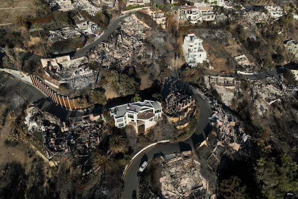 An aerial view shows the devastation by the Palisades Fire Thursday, Jan. 16, 2025 in Malibu, Calif. (AP Photo/Jae C. Hong)