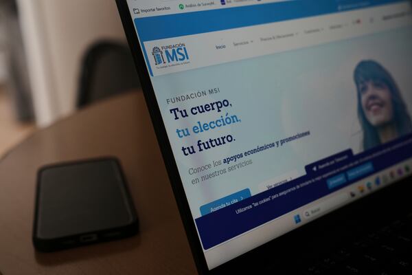 A computer monitor shows the splash page of the MSI Foundation website with a message that reads in Spanish: "Your body, your choice, your future", during a tour of the foundation, a non-governmental agency that offers information and help to women seeking abortions, in Mexico City, Thursday, May 8, 2025. (AP Photo/Marco Ugarte)