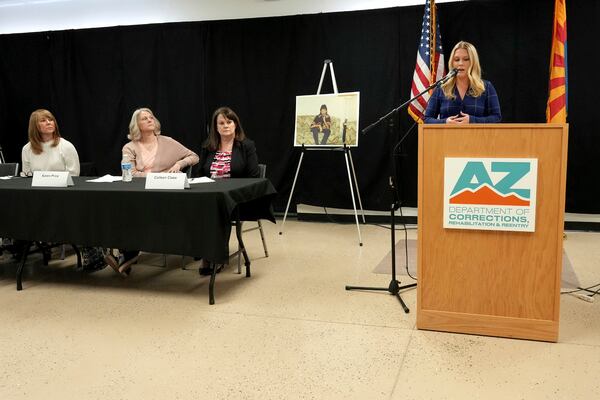 Ashley Holden of ABC 15 Arizona speaks about witnessing the execution of inmate Aaron Brian Gunches as counsel and family members of the victim look on during a press briefing at the Arizona State Prison Wednesday, March 19, 2025 in Florence, Ariz. (AP Photo/Darryl Webb)