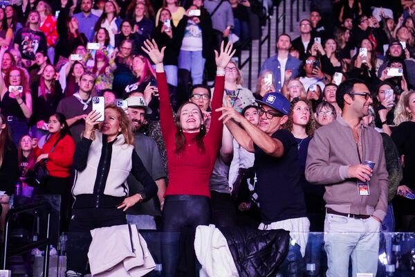 Audience members watch Katy Perry perform during the FireAid benefit concert on Thursday, Jan. 30, 2025, at Intuit Dome in Inglewood, Calif. (Photo by Jordan Strauss/Invision/AP)