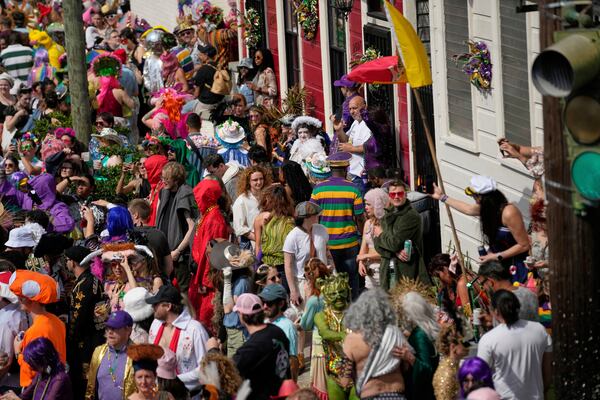 The streets are filled during the Society of Saint Anne's parade on Mardi Gras Day, Tuesday, March 4, 2025 in New Orleans. (AP Photo/Gerald Herbert)