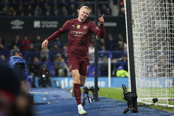 Manchester City's Erling Haaland celebrates scoring his side's 5th goal during the English Premier League soccer match between Ipswich Town and Manchester City at Portman Road stadium in Ipswich, England, Sunday, Jan. 19, 2025. (AP Photo/Ian Walton)