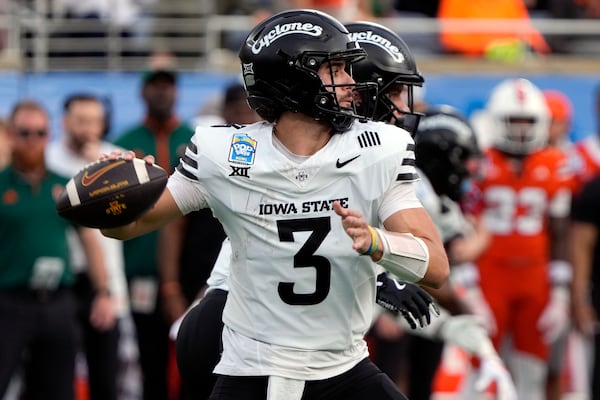 Iowa State quarterback Rocco Becht (3) throws a pass during the first half of the Pop Tarts Bowl NCAA college football game against Miami, Saturday, Dec. 28, 2024, in Orlando, Fla. (AP Photo/John Raoux)