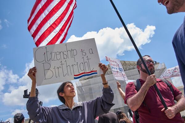 Tanjam Jacobson, of Silver Spring, Md., holds a sign saying "Citizenship is a Birthright," Thursday, May 15, 2025, outside the Supreme Court in Washington. Jacobson is a naturalized U.S. citizen who was born in England of Indian descent, and her son was born here. "This is something that really matters," says Jacobson, "it's so wrong against the constitution [to take away birthright citizenship]." (AP Photo/Jacquelyn Martin)
