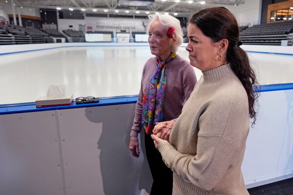 Former Olympic skater Nancy Kerrigan, right, walks with fellow Olympic skater Tenley Albright, at The Skating Club of Boston, where six members of the club's community, including athletes, coaches and family, were killed in an airplane collision with a helicopter on Wednesday in Washington, Thursday, Jan. 30, 2025, in Norwood, Mass. (AP Photo/Charles Krupa)