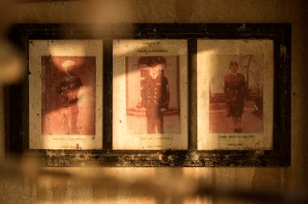 Photos of U.S. veterans charred by the Eaton Fire hang on a wall inside the Terraces at Park Marino on Monday, Jan. 13, 2025, in Pasadena, Calif. (AP Photo/Chris Pizzello)