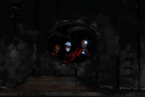 Firefighters and emergency teams work after a fire that broke out at a hotel in the ski resort of Kartalkaya, located in Bolu province, northwest Turkey, on Tuesday, Jan. 21, 2025. (AP Photo/Francisco Seco)