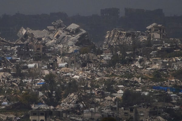 Buildings destroyed during the Israeli air and ground offensive in the Gaza Strip as seen from southern Israel, Thursday, March 20, 2025. (AP Photo/Leo Correa)