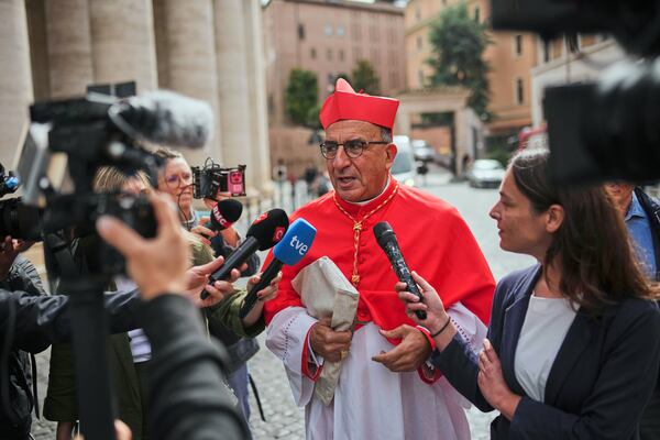 Cardinal Fernando Natalio Chomali Garib talks to journalists as he arrives at the Vatican, Friday, May 9, 2025, a day after Pope Leo XIV was elected as the first North American pope. (AP Photo/Francisco Seco)